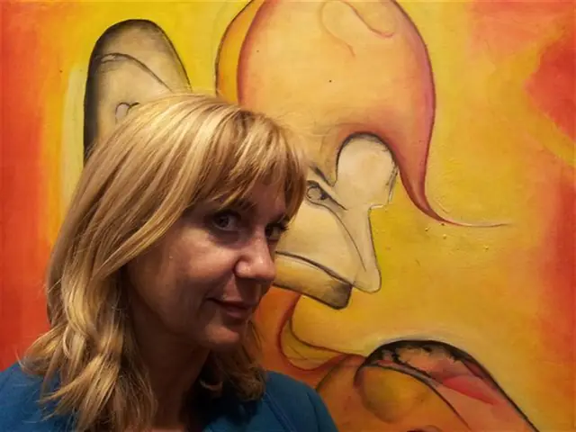 Elena Rivautella with one of her paintings