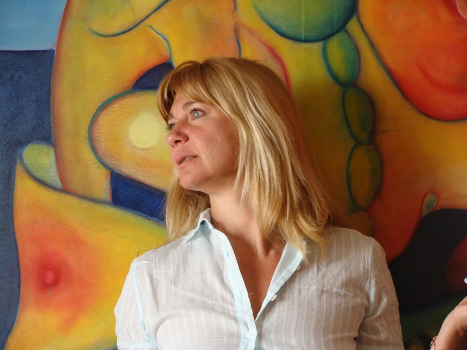 Elena Rivautella in front of one of her paintings